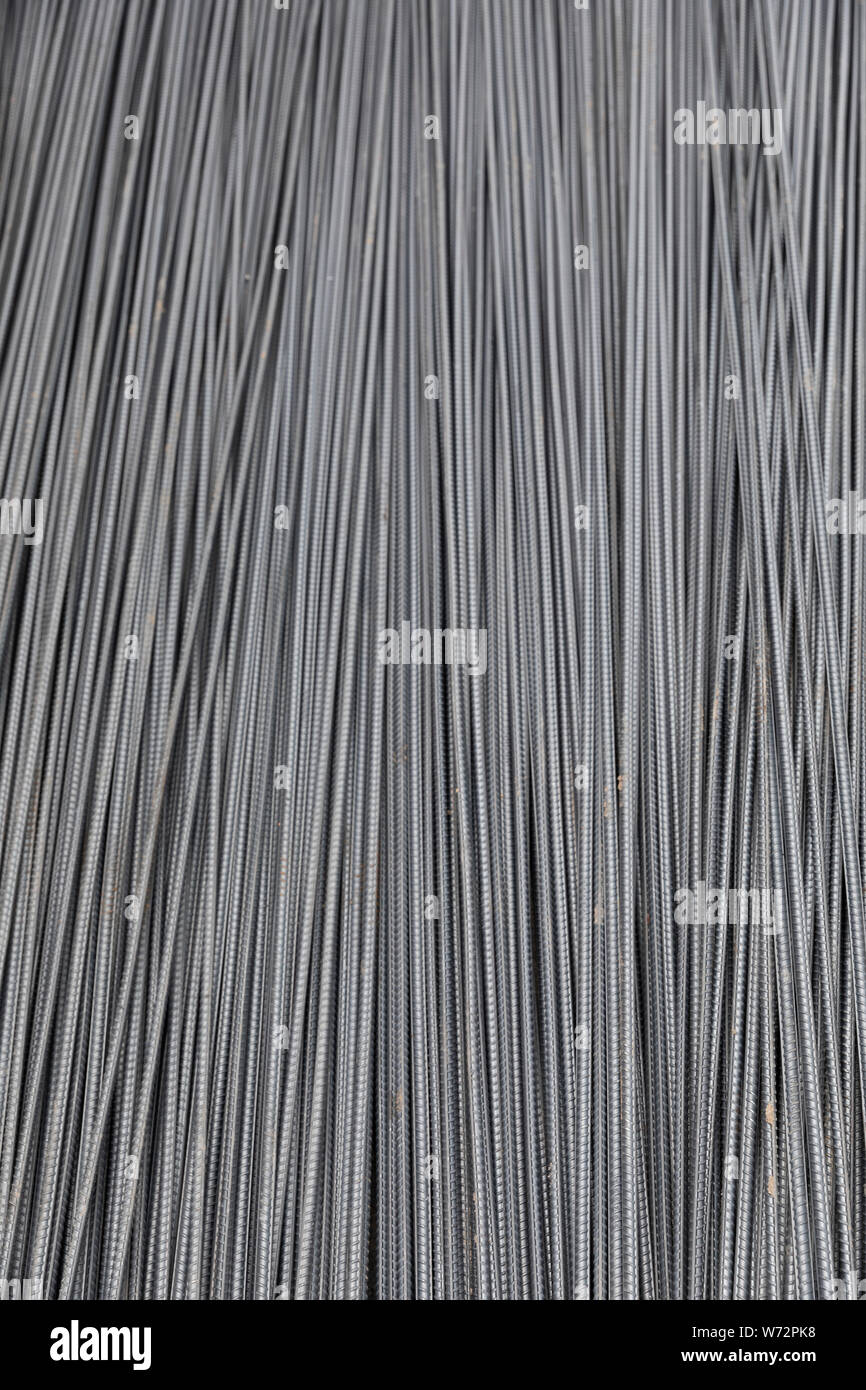 Steel Rods on a building site for reinforcing concrete.The reinforcing steel rods, absorb the tensile, shear, and compressive forces in the concrete Stock Photo