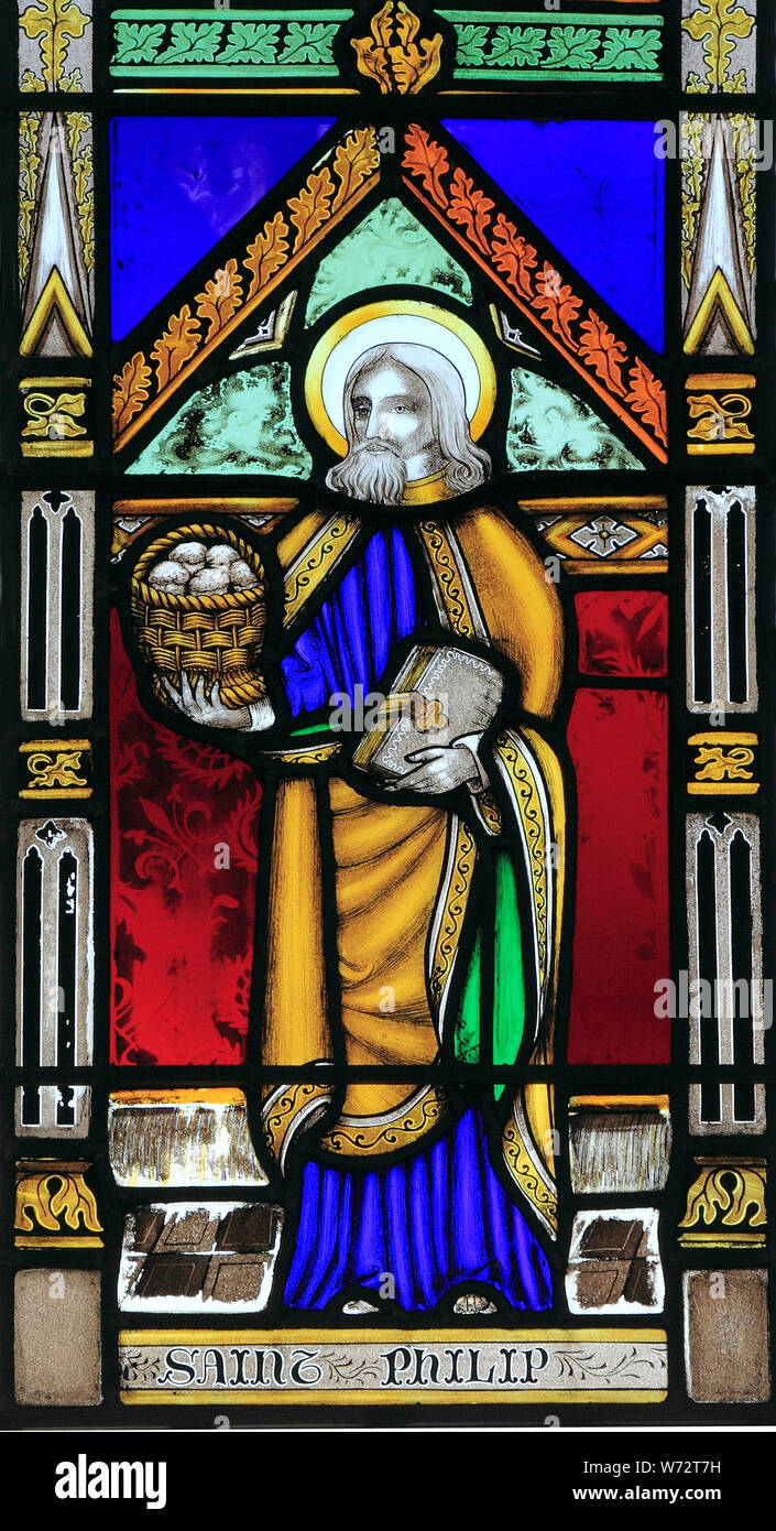 St. Philip, with basket of loaves, to feed five thousand, stained glass window, by Joseph Grant of Costessey, c. 1856,  Wighton church, Norfolk Stock Photo