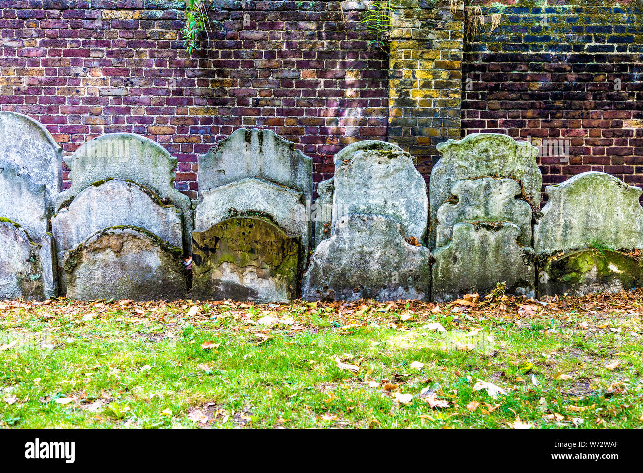Tightly packed gravestones in the churchyard gardens of St John at Hackney Church, London, UK Stock Photo