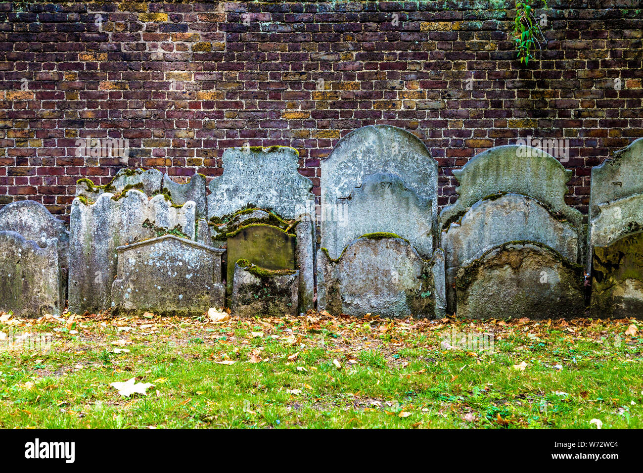 Tightly packed gravestones in the churchyard gardens of St John at Hackney Church, London, UK Stock Photo