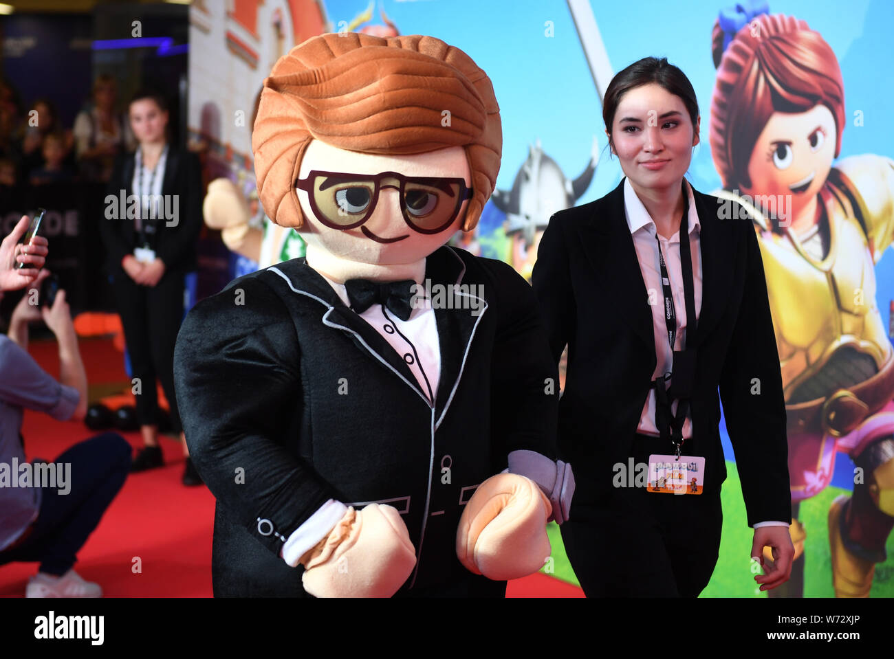 Munich, Germany. 04th Aug, 2019. A Living Playmobil character is standing  on the red carpet at the film premiere "Playmobil - the film" in the  Mathäser cinema. The animated film will be