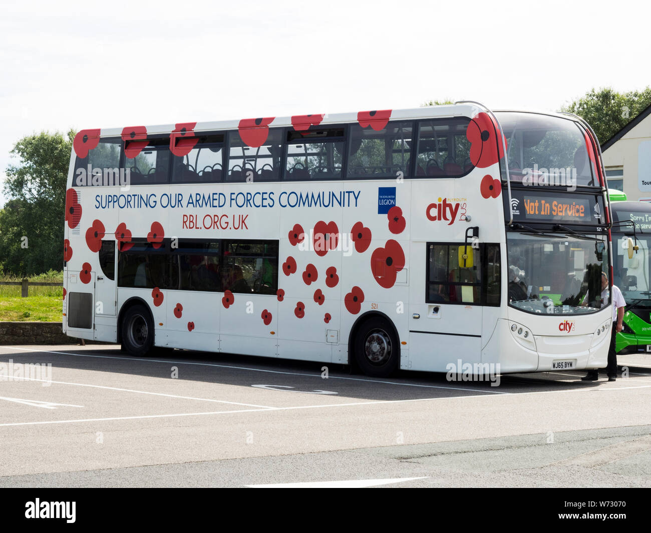 Coach covered in poppies, Royal British Legion advertising, UK Stock Photo