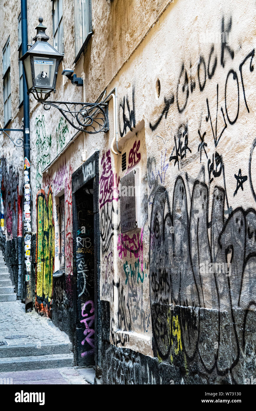 The narrowest street in Stockholm, Mårten Trotzigs Gränd, graffiti covered walls. Gamla Stan, Stockholm, Sweden Stock Photo