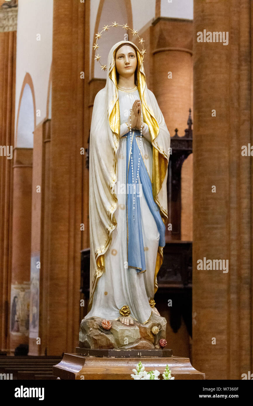 The statue of Our Lady of Lourdes in the 'Santa Maria del Carmine' church (Holy Mary of Carmel) in Pavia. Stock Photo