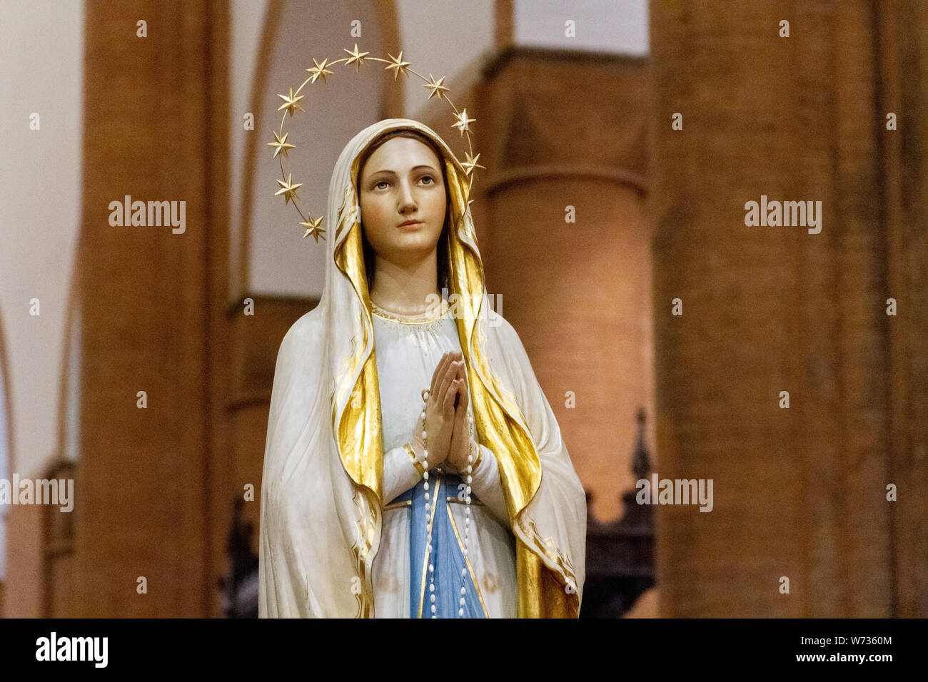 The statue of Our Lady of Lourdes in the 'Santa Maria del Carmine' church (Holy Mary of Carmel) in Pavia. Stock Photo