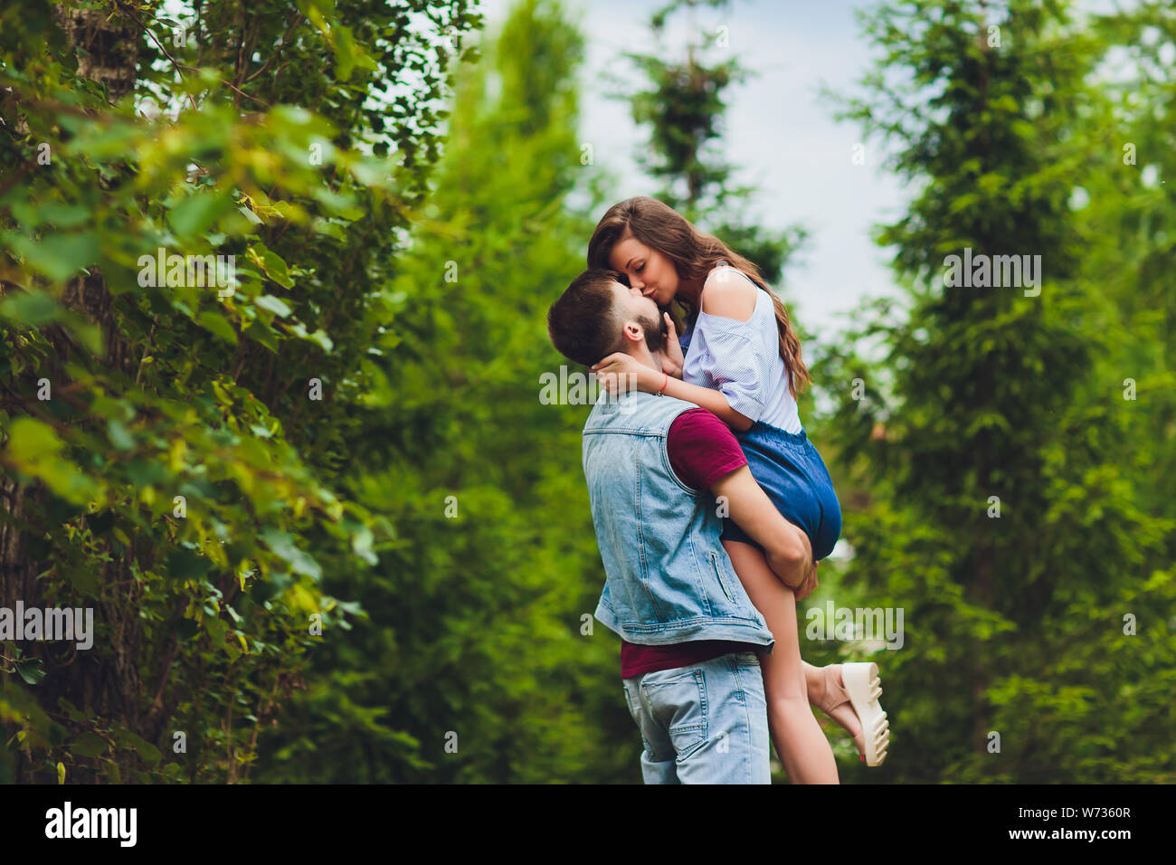 Cheerful young couple having fun and laughing together outdoors Stock ...