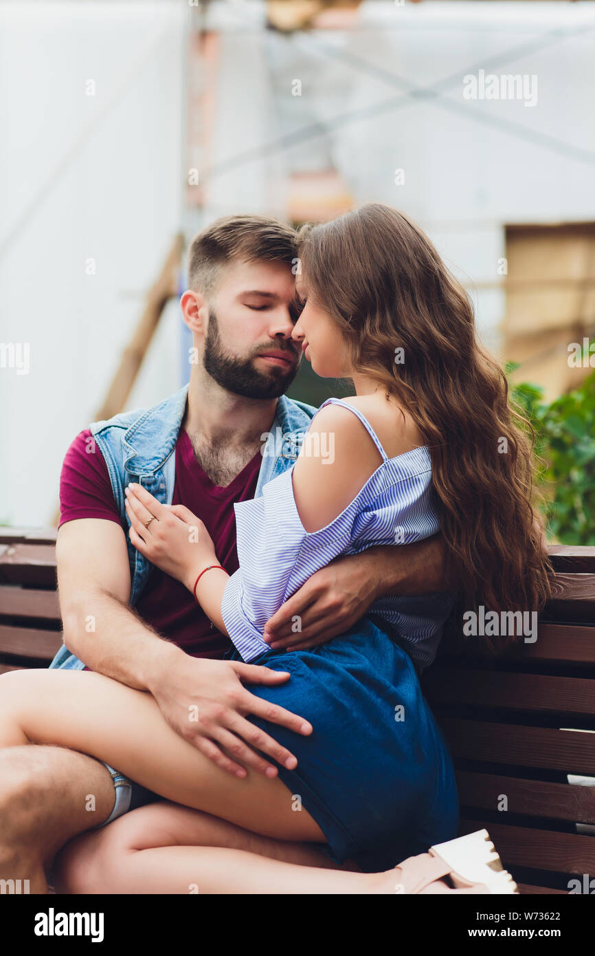 Cheerful young couple having fun and laughing together outdoors Stock ...