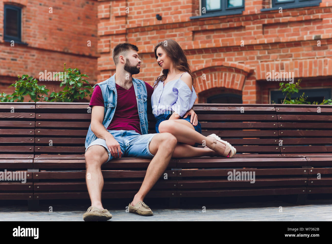 Cheerful young couple having fun and laughing together outdoors Stock ...