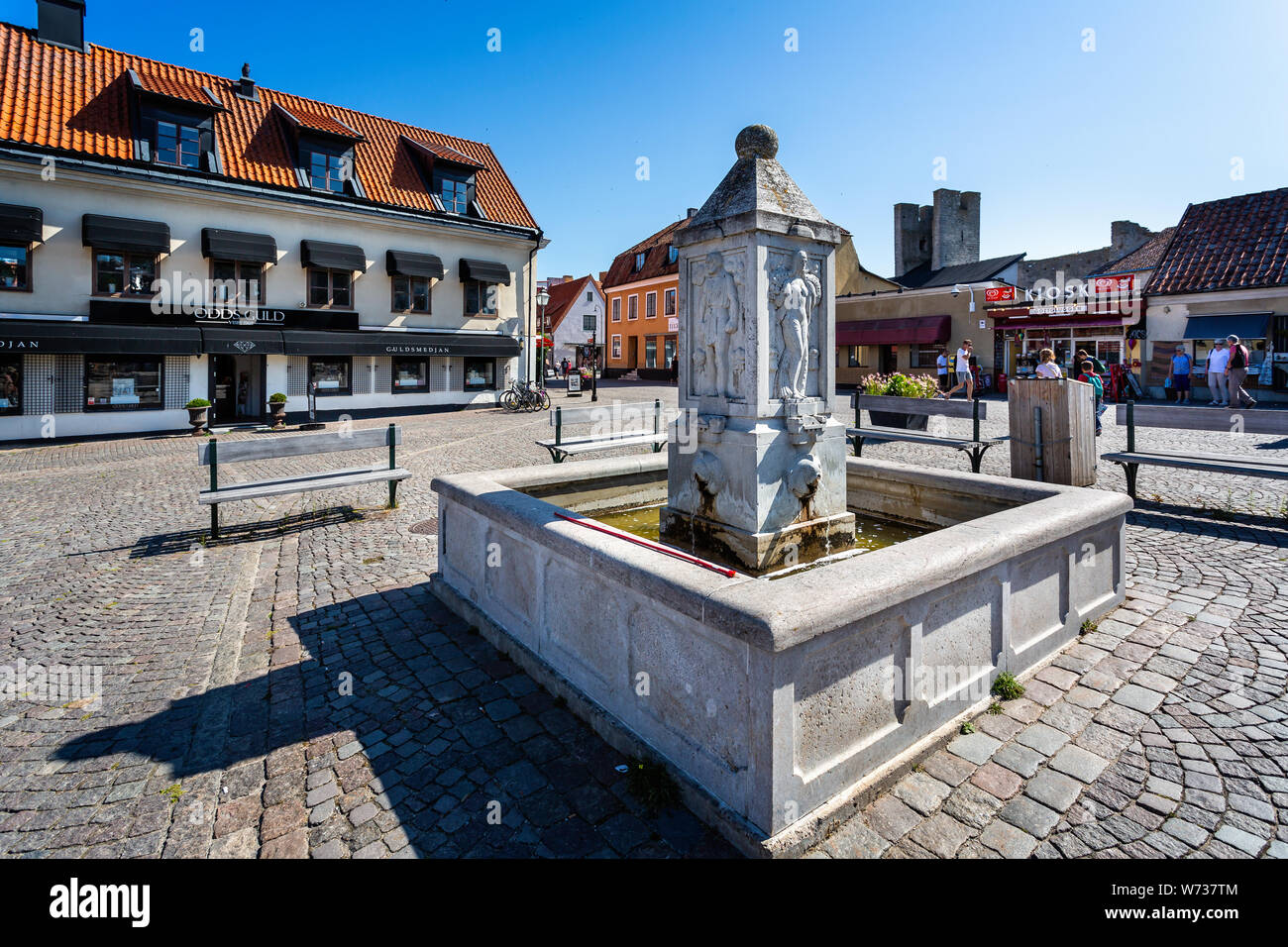 Small town fountain in the centre of the Hanseatic town of Visby, Gotland, Sweden on 20 July 2019 Stock Photo