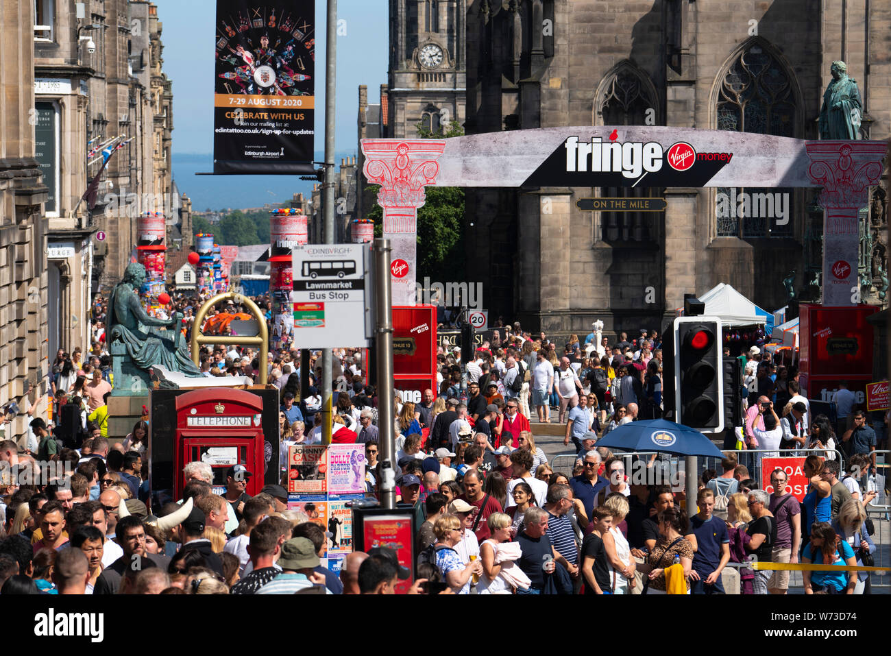 Edinburgh, Scotland, UK. 4 August 2019. On the first weekend of the Edinburgh Fringe Festival good weather brought out thousands of tourists to enjoy Stock Photo