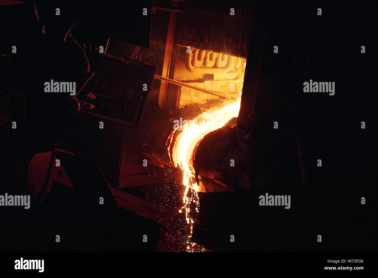 Melting of metal in a steel plant. High temperature in the melting ...