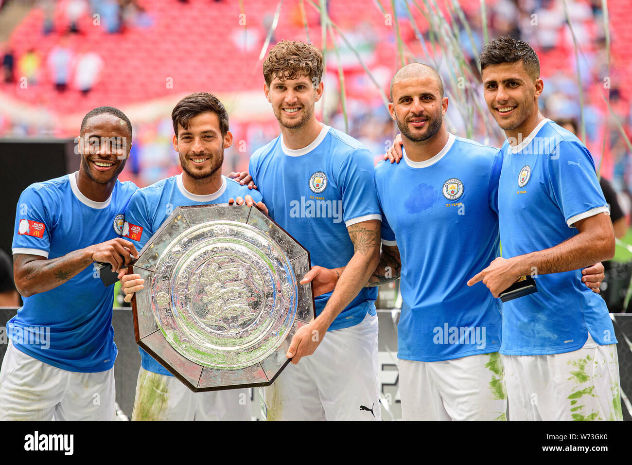 London, UK. 4th Aug 2019. Manchester City forward Raheem Sterling, Manchester City midfielder Bernardo Silva, Manchester City defender John Stones, Manchester City defender Kyle Walker and Manchester City midfielder Rodrigo pose with the Charity Shield during the FA Community Shield match between Manchester City and Liverpool at Wembley Stadium, London on Sunday 4th August 2019. (Credit: Jon Hobley | MI News) Credit: MI News & Sport /Alamy Live News Stock Photo