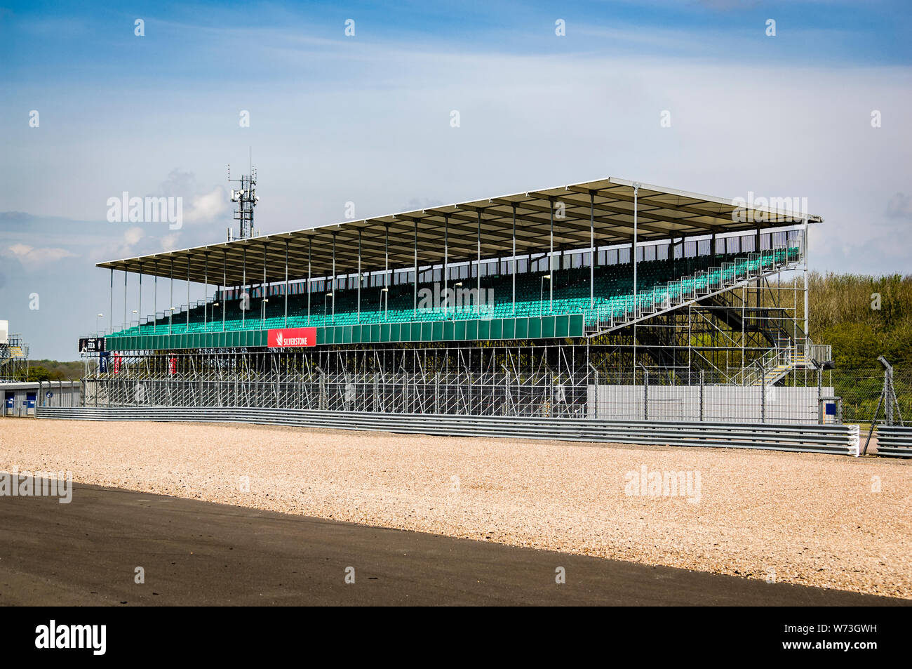 An empty grandstand at Silverstone, taken in front of the original pit lane on the national Pits Straight. Stock Photo