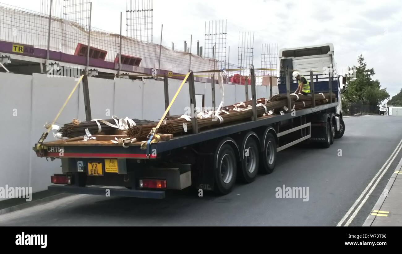 A Volvo lorry with flat bed trailer delivering metal to the Torwood