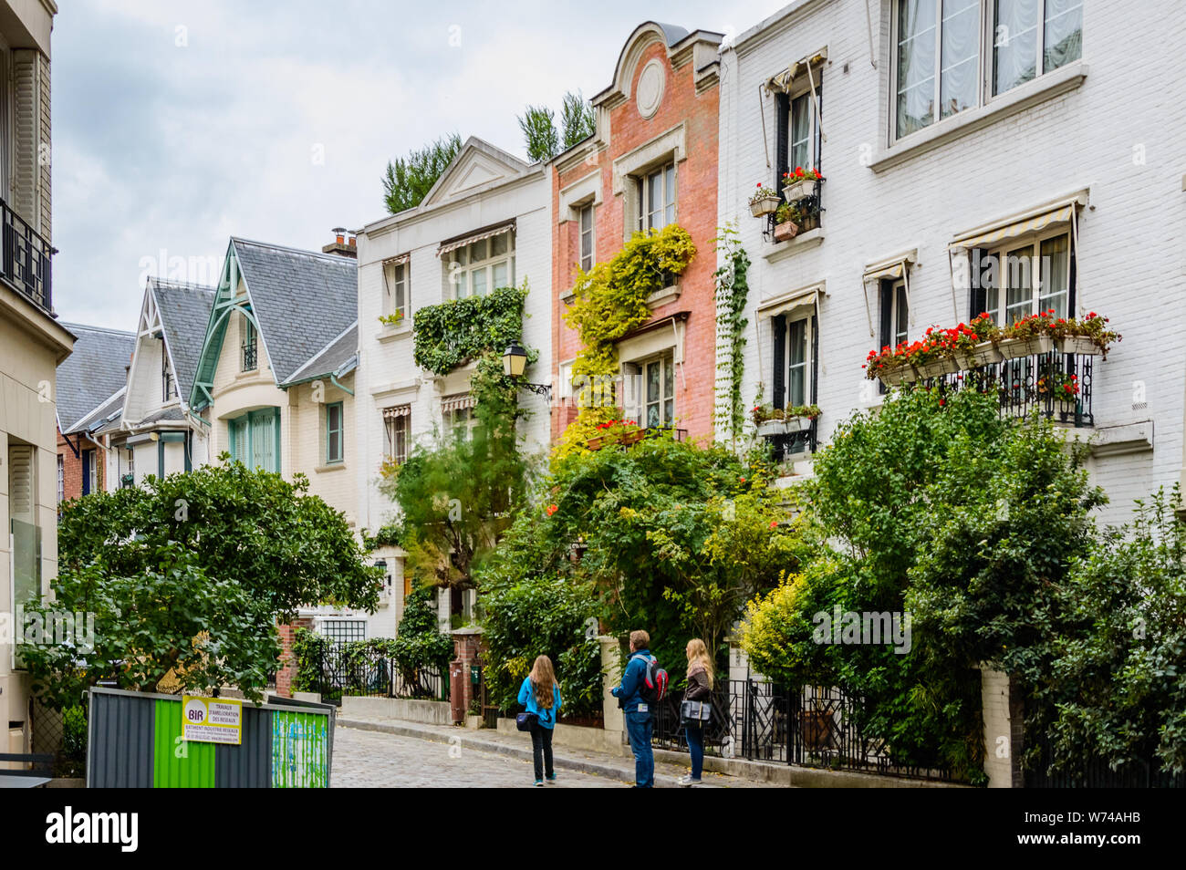 Paris residential buildings. Old Paris architecture, beautiful facade, typical french houses on sunny day. Famous travel destinations in Europe. City Stock Photo