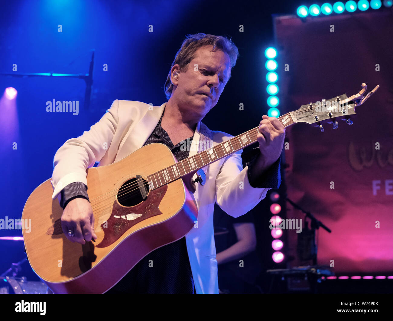 Emmy award Golden Globe winner, British-Canadian actor and musician Kiefer William Frederick Dempsey George Rufus Sutherland aka Kiefer Sutherland performs live on stage with his band day 4  during Wickham Festival in Hampshire. Stock Photo