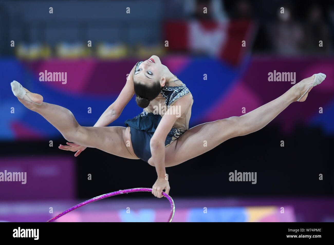 Lima, Peru. 4th Aug, 2019. EVITA GRISKENAS from the US does a leap with the hoop during the competition held in the Polideportivo Villa El Salvador in Lima, Peru. Credit: Amy Sanderson/ZUMA Wire/Alamy Live News Stock Photo