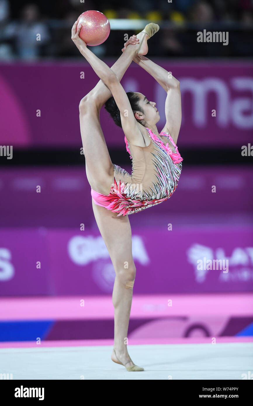 Lima, Peru. 4th Aug, 2019. NATALIE GARCIA from Canada does a turn with her foot over her head during the competition held in the Polideportivo Villa El Salvador in Lima, Peru. Credit: Amy Sanderson/ZUMA Wire/Alamy Live News Stock Photo