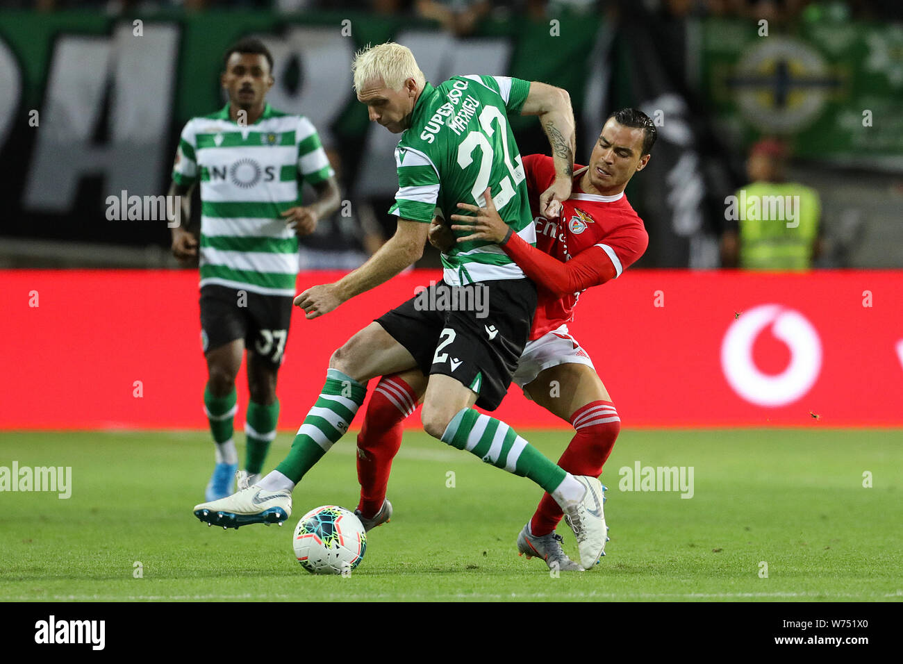 Lisbon, Portugal. 04th Aug, 2019. Jérémy Mathieu of Sporting CP (L) vies  for the ball with Raul de Tomás of SL Benfica (R) during the Final Cândido  de Oliveira SuperCup 2019 football