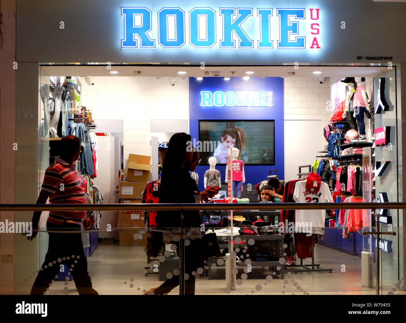 Visitors seen past Rookie USA Garments store at the Quest Mall in Kolkata. Stock Photo