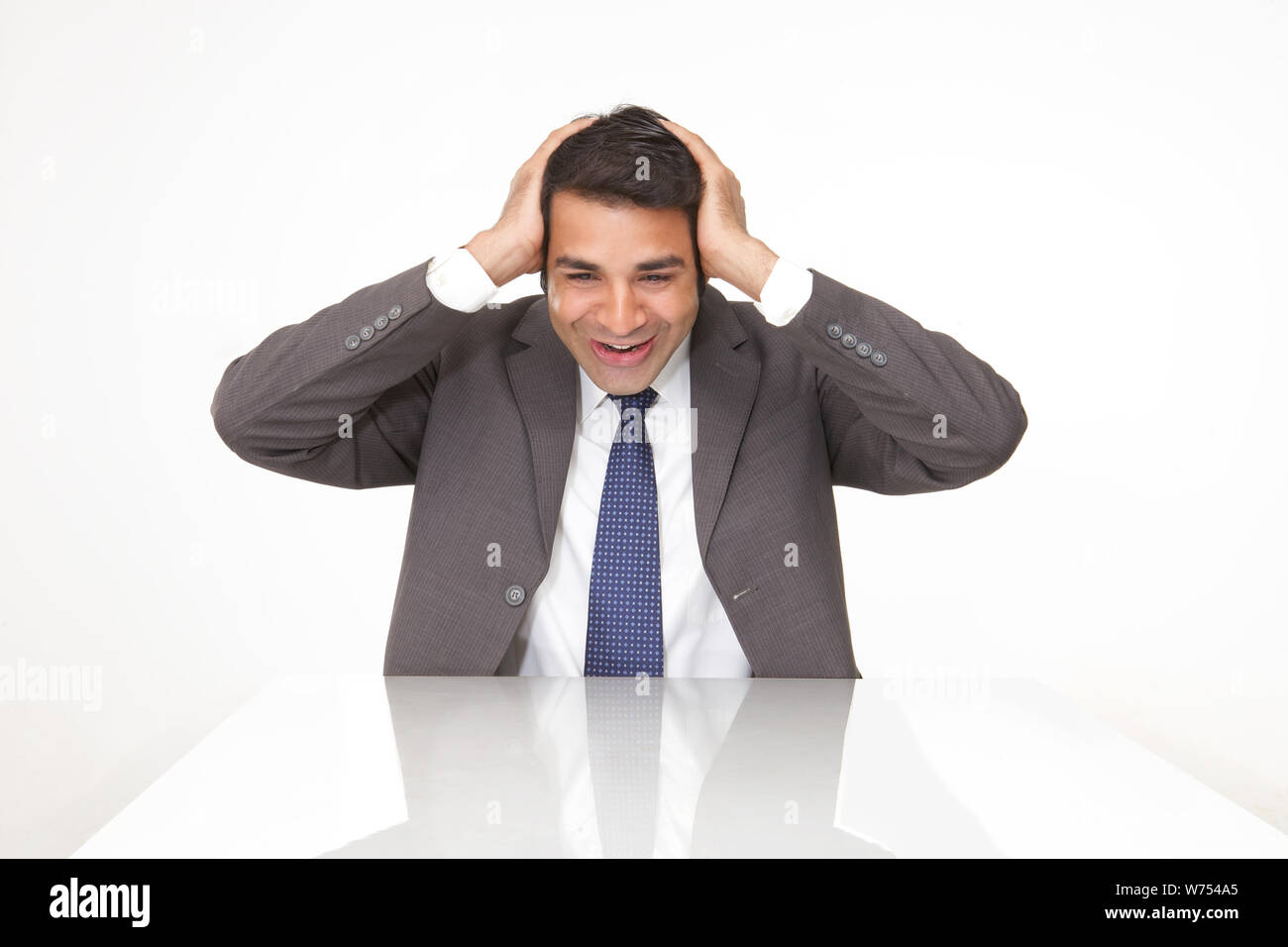 Shocked man in disbelief sitting hi-res stock photography and images ...
