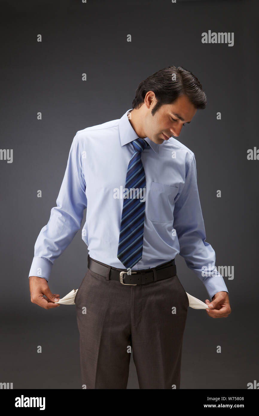 Man showing empty pockets hires stock photography and images Alamy