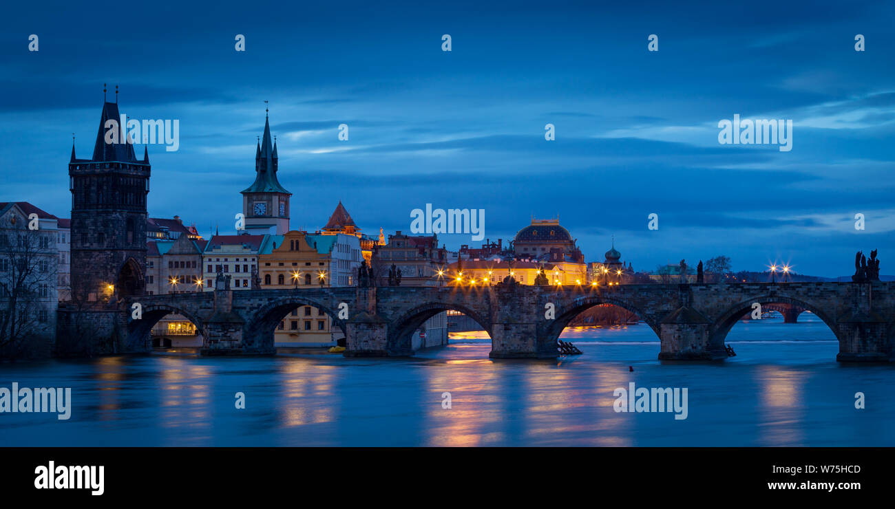 Morning view of Charles Bridge and Old Town Bridge Tower over river Vltava, Prague. Stock Photo