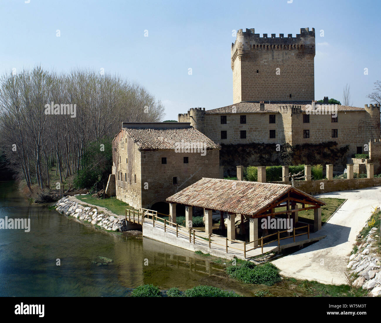Spain. La Rioja. Cuzcurrita del Rio Tiron. Velasco Castle (early 15th century) next to Tiron river. Stock Photo
