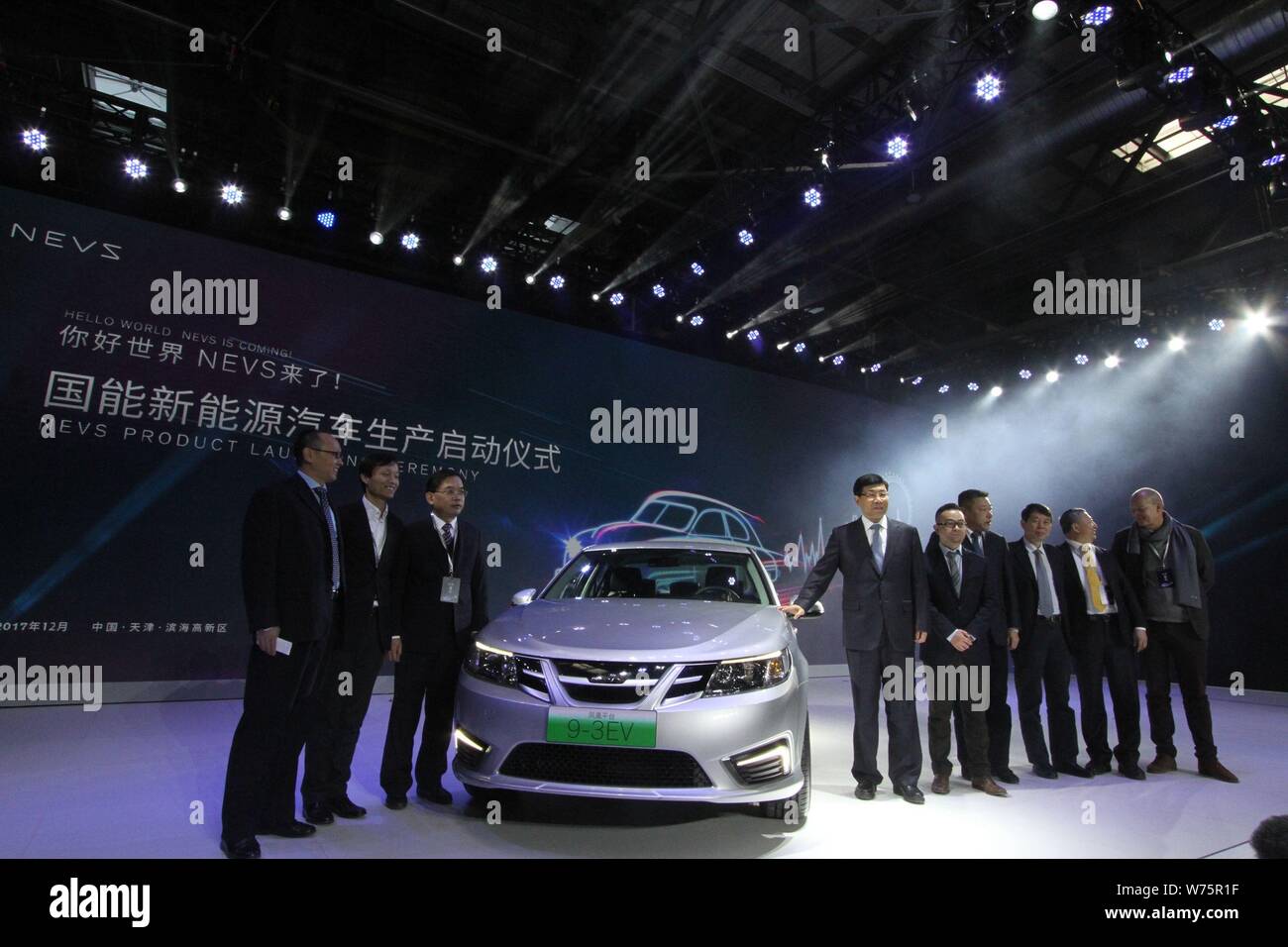 Executives and guests of National Electric Vehicle Sweden (NEVS) pose