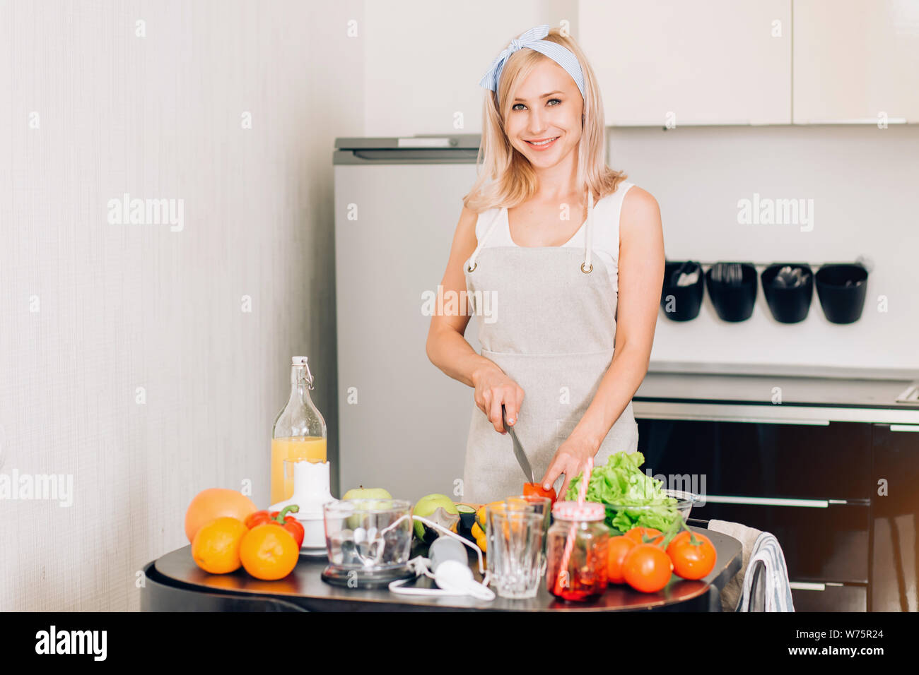 Woman cutting vegetables in the kitchen. Cooking healthy diet food concept  Stock Photo - Alamy