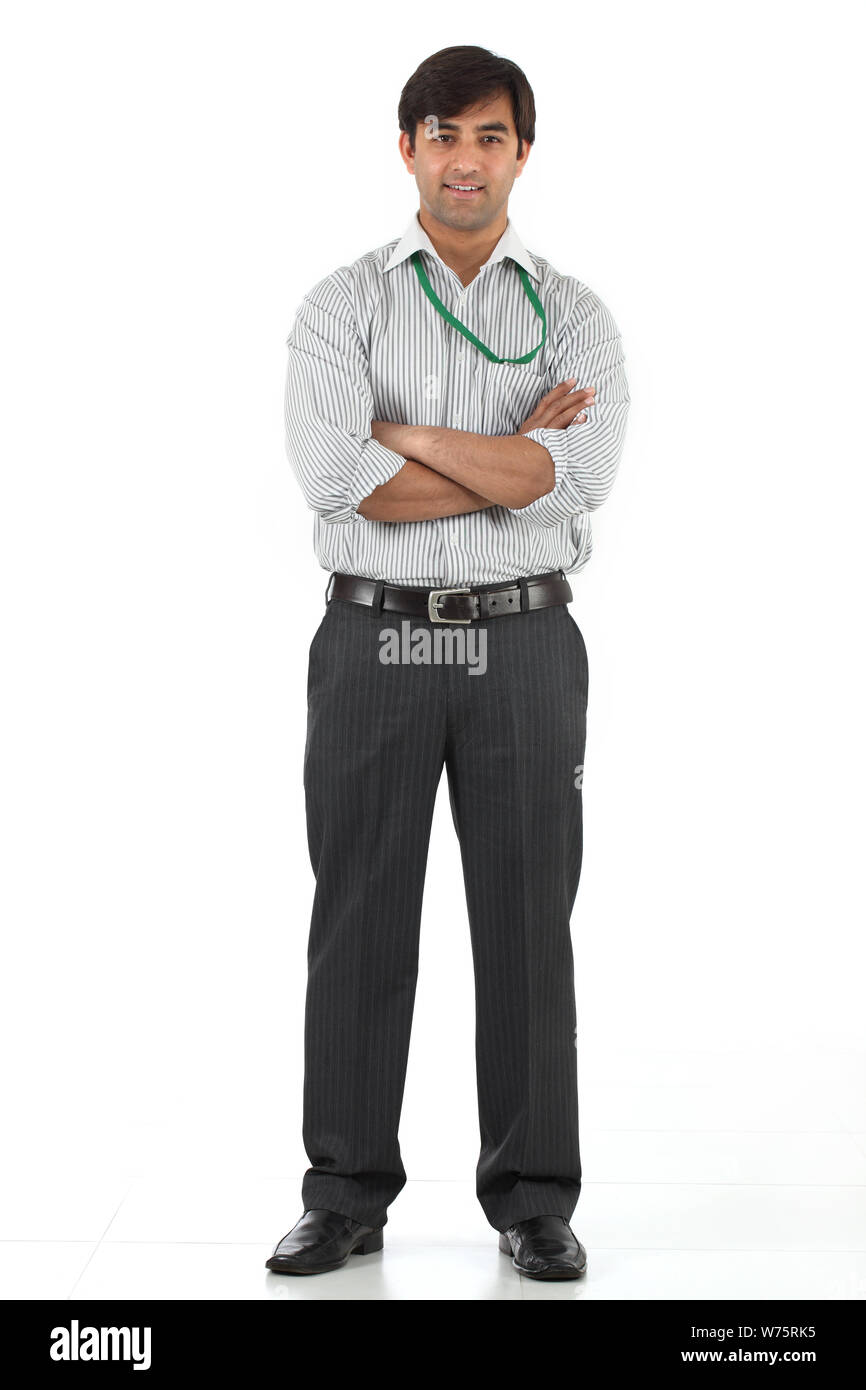 Salesman smiling with his arms crossed Stock Photo