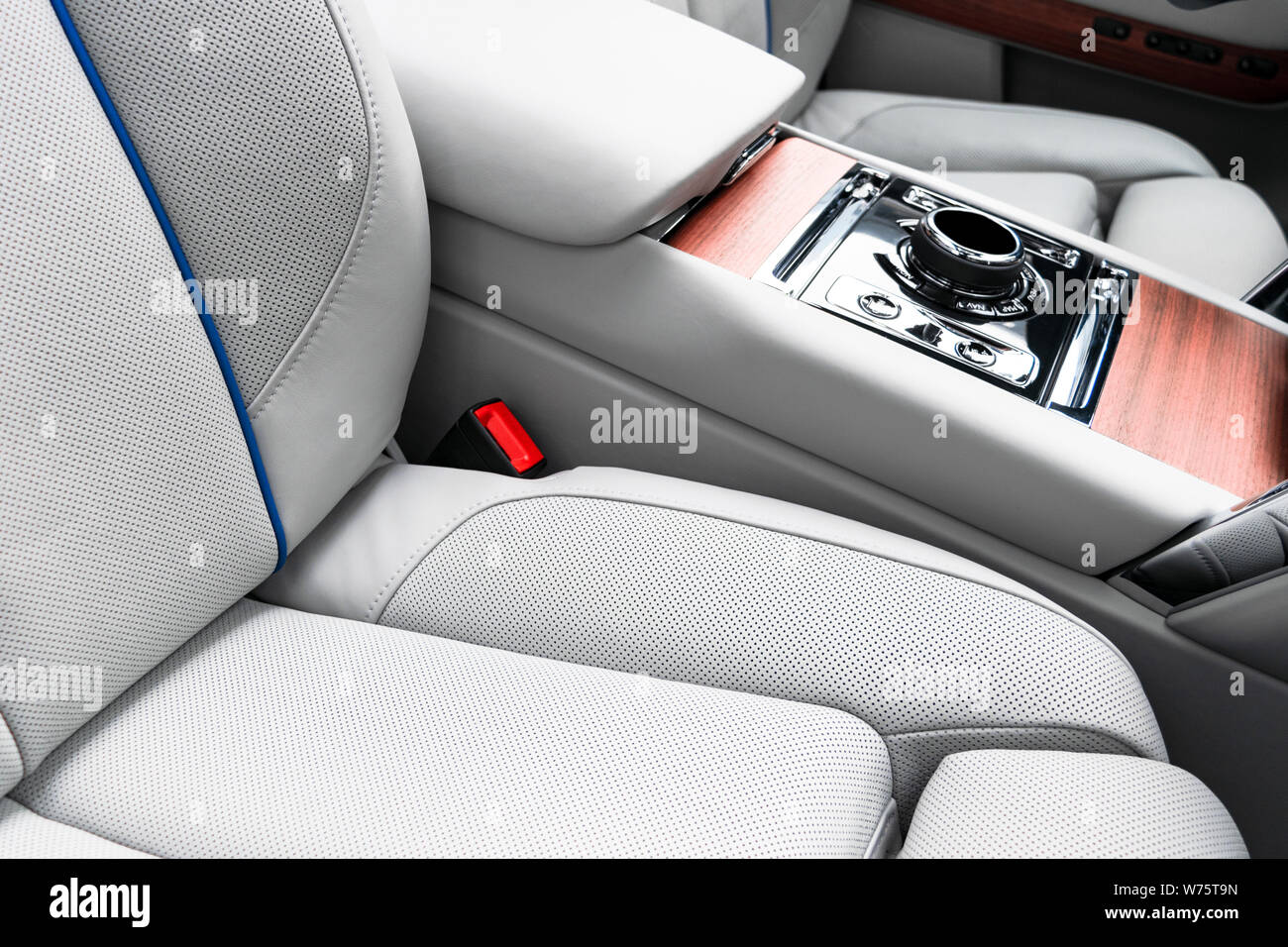 Modern luxury car white leather interior with natural wood panel. Part