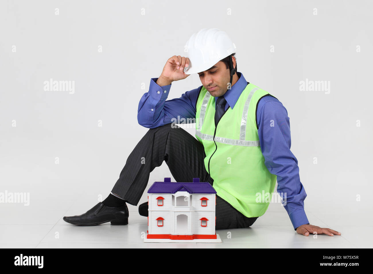 Architect showing model of dream home Stock Photo