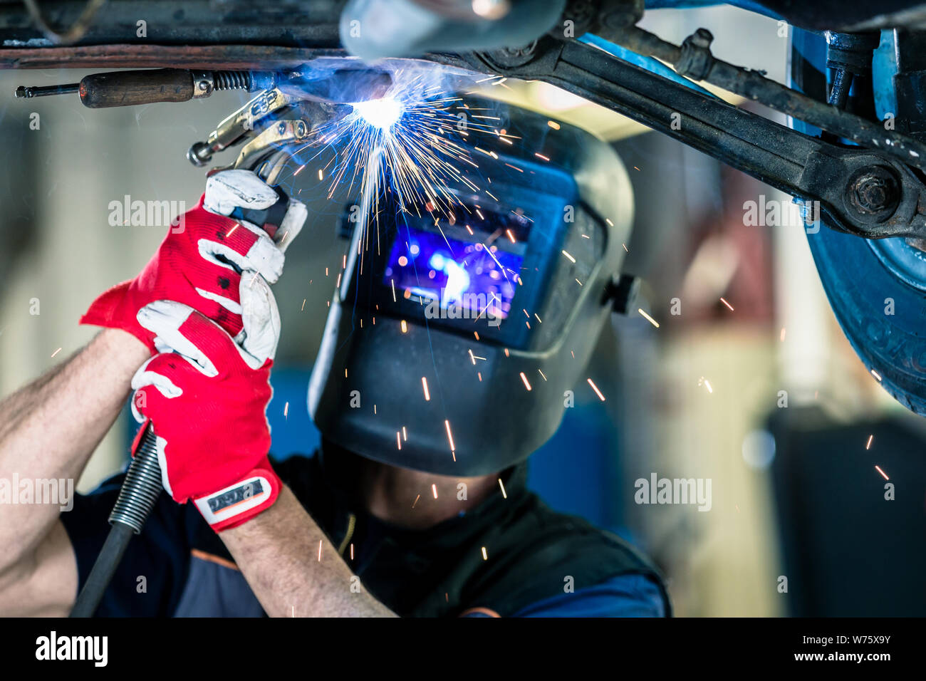 Mechanic welding automobile part Stock Photo Alamy