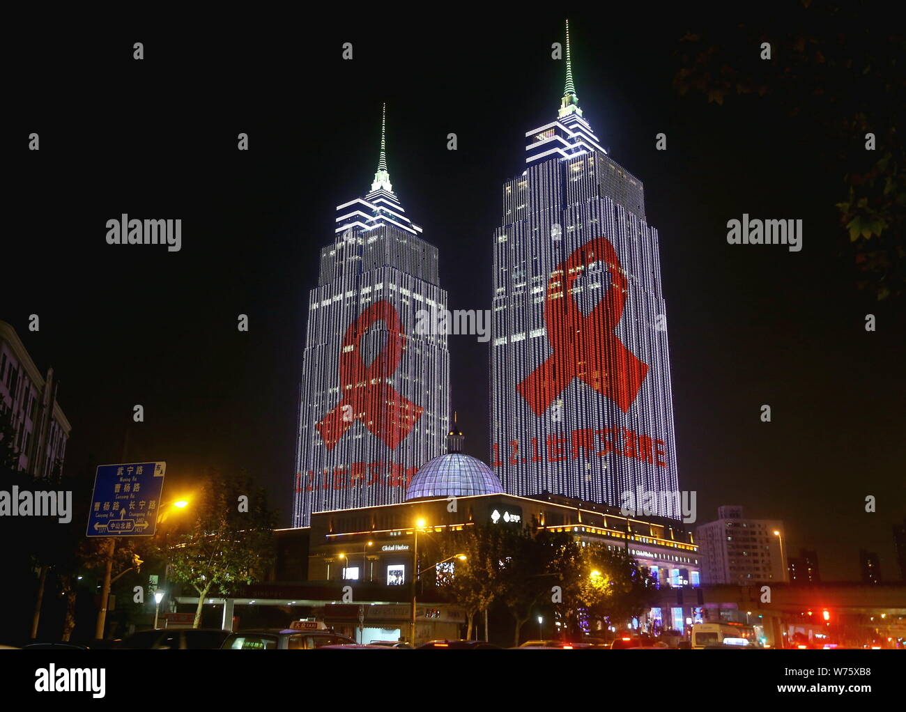 The two towers of the Global Harbor shopping mall are illuminated with ...