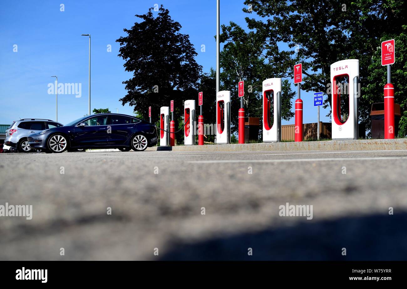 A electric vehicle charging station of Tesla at a service area of Interstate Highway 95 near Kennebunk in the state of Maine (USA), 20 July 2019. | usage worldwide Stock Photo