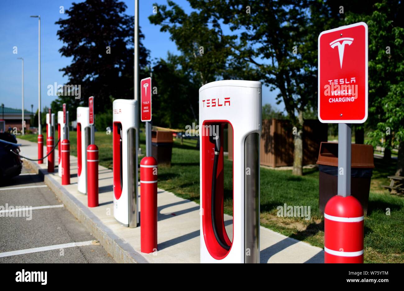 A electric vehicle charging station of Tesla at a service area of Interstate Highway 95 near Kennebunk in the state of Maine (USA), 20 July 2019. | usage worldwide Stock Photo