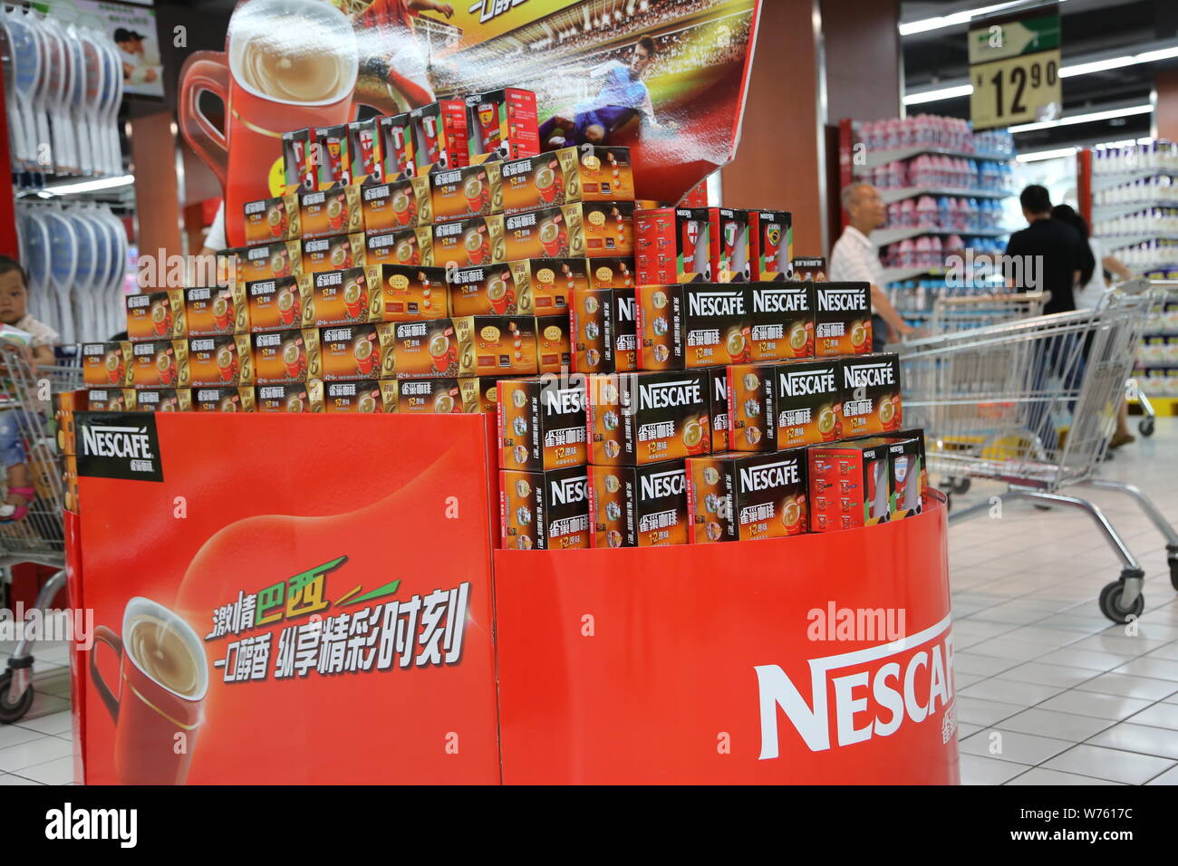 --FILE--Cartons of Nescafe instant coffee of Nestle are for sale at a supermarket in Xuchang city, central China's Henan province, 29 June 2014.     S Stock Photo