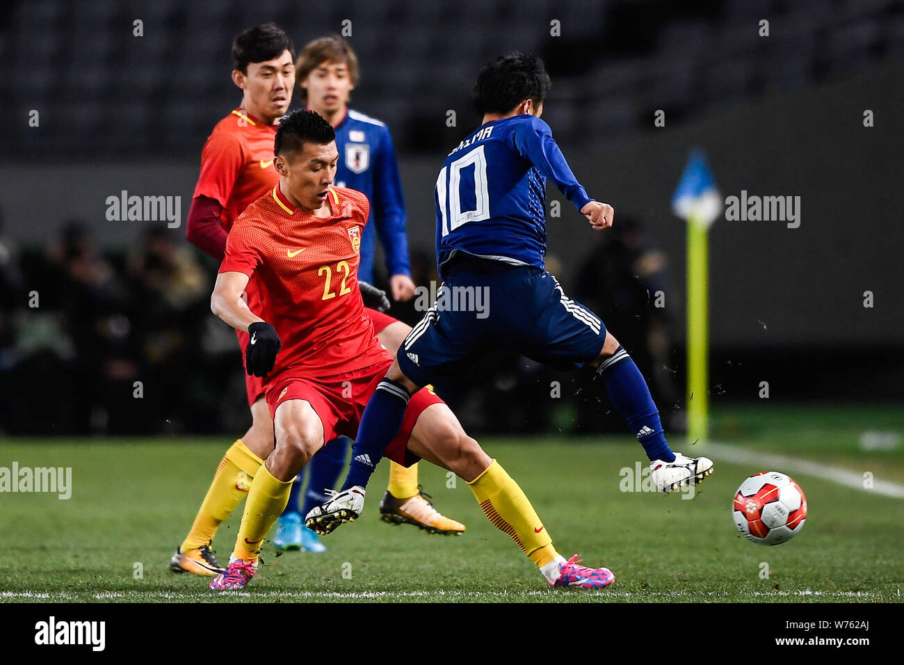 Oshima Ryota, right, of Japan kicks the ball to make a pass against Yu Dabao of China during the EAFF E-1 Football Championship 2017 Final Japan in To Stock Photo