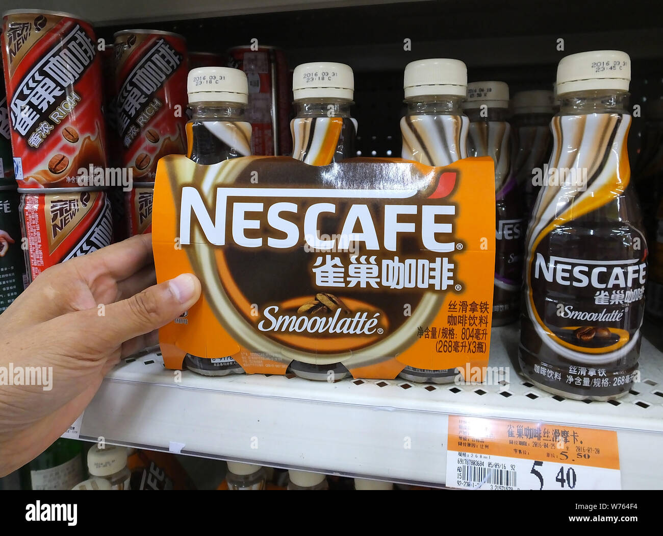 --FILE--A customer picks Nescafe instant coffee of Nestle at a supermarket in Yichang city, central China's Hubei province, 23 June 2016.   Switzerlan Stock Photo
