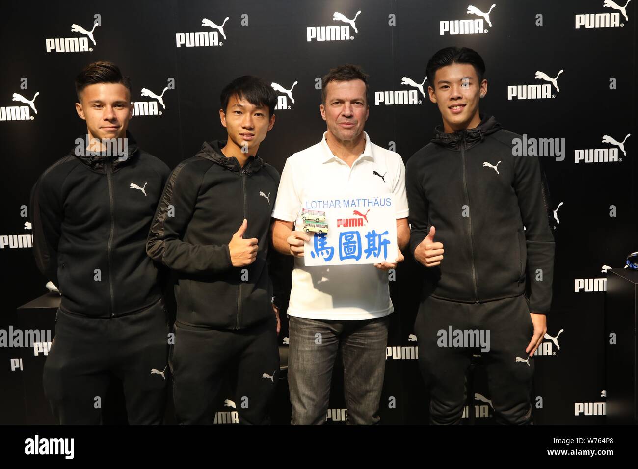 Former German football star Lothar Matthaus, second right, poses for photos  with fans during a promotional event for Puma in Hong Kong, China, 5 Decem  Stock Photo - Alamy