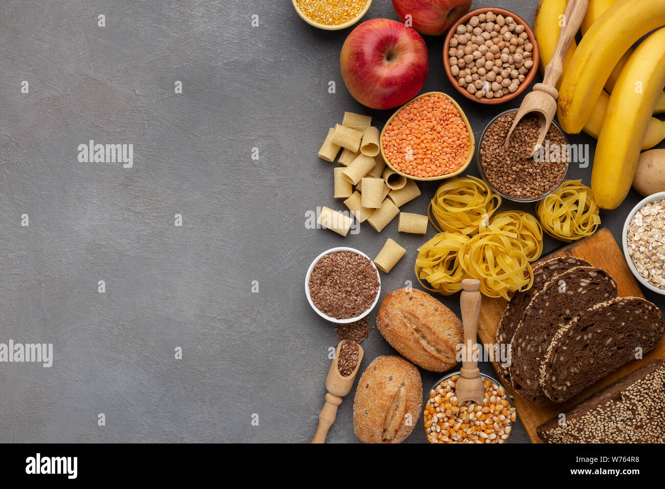 Assortment of food rich on fiber and carbohydrates on gray Stock Photo