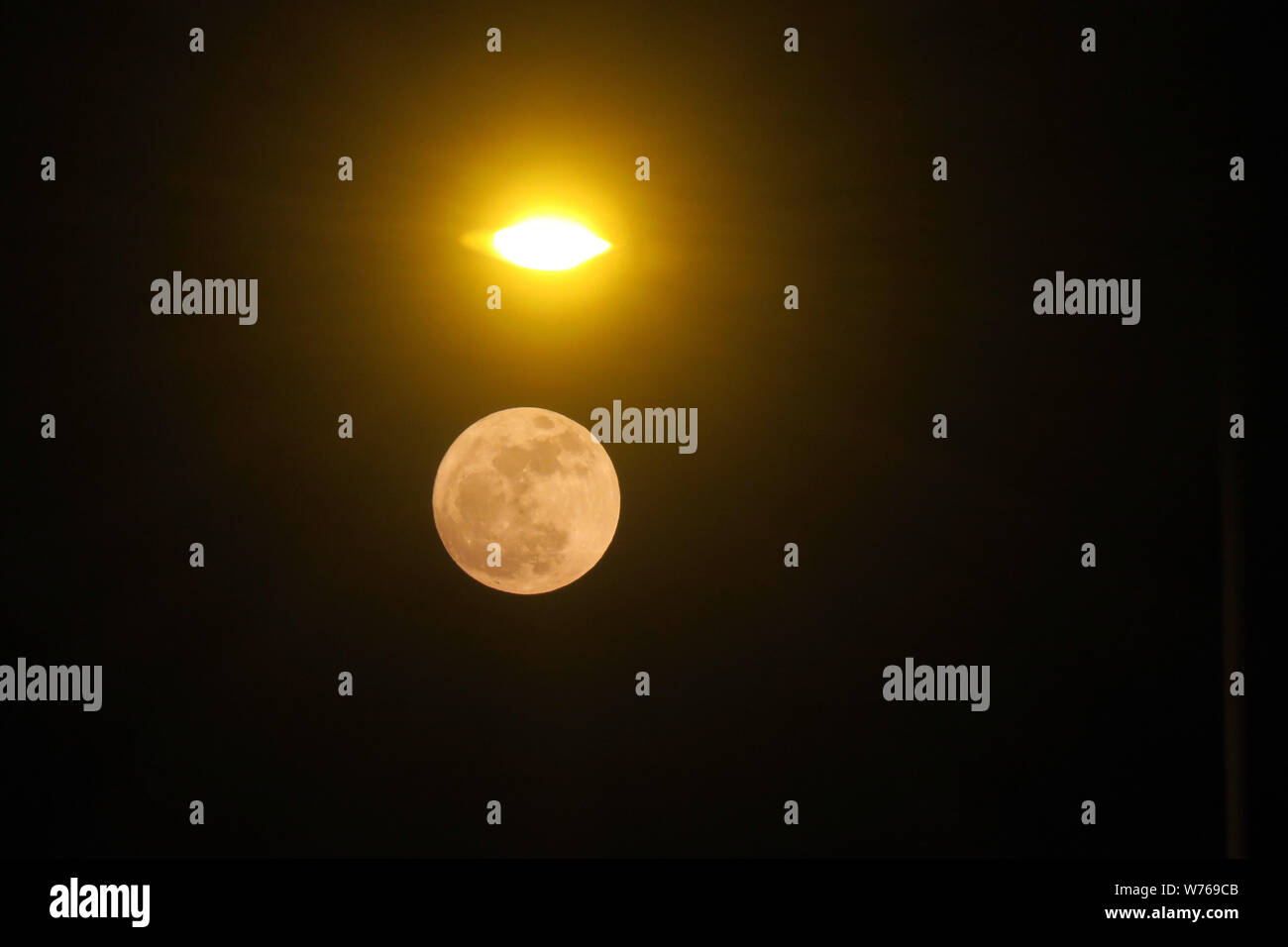 A supermoon is seen in the night sky over Hong Kong, China, 3 December ...