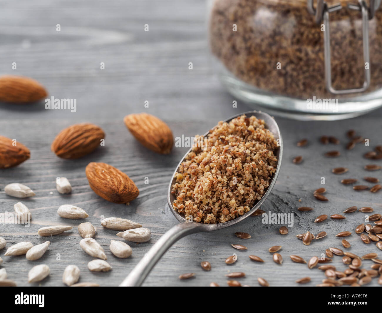 Homemade LSA mix in spoon - Linseed or flax seeds, Sunflower seeds and Almonds. Traditional Australian blend of ground, source of dietary fiber, protein, omega fatty acids. Copy space for text. Stock Photo
