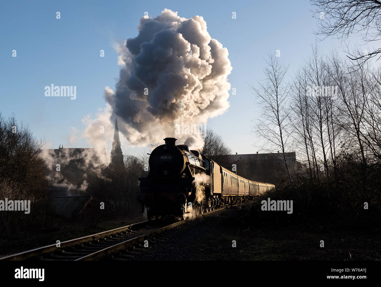 Normally seen working the Jocobite, Black 5 No. 45407 is seen leaving Bury on the ELR. Stock Photo