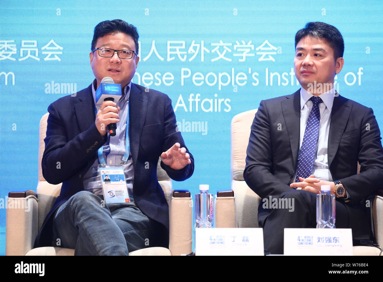 William Ding Lei, left, CEO of Netease (163.com), and Richard Liu Qiangdong, Chairman and CEO of online retailer JD.com, attend the forum of 'Internat Stock Photo