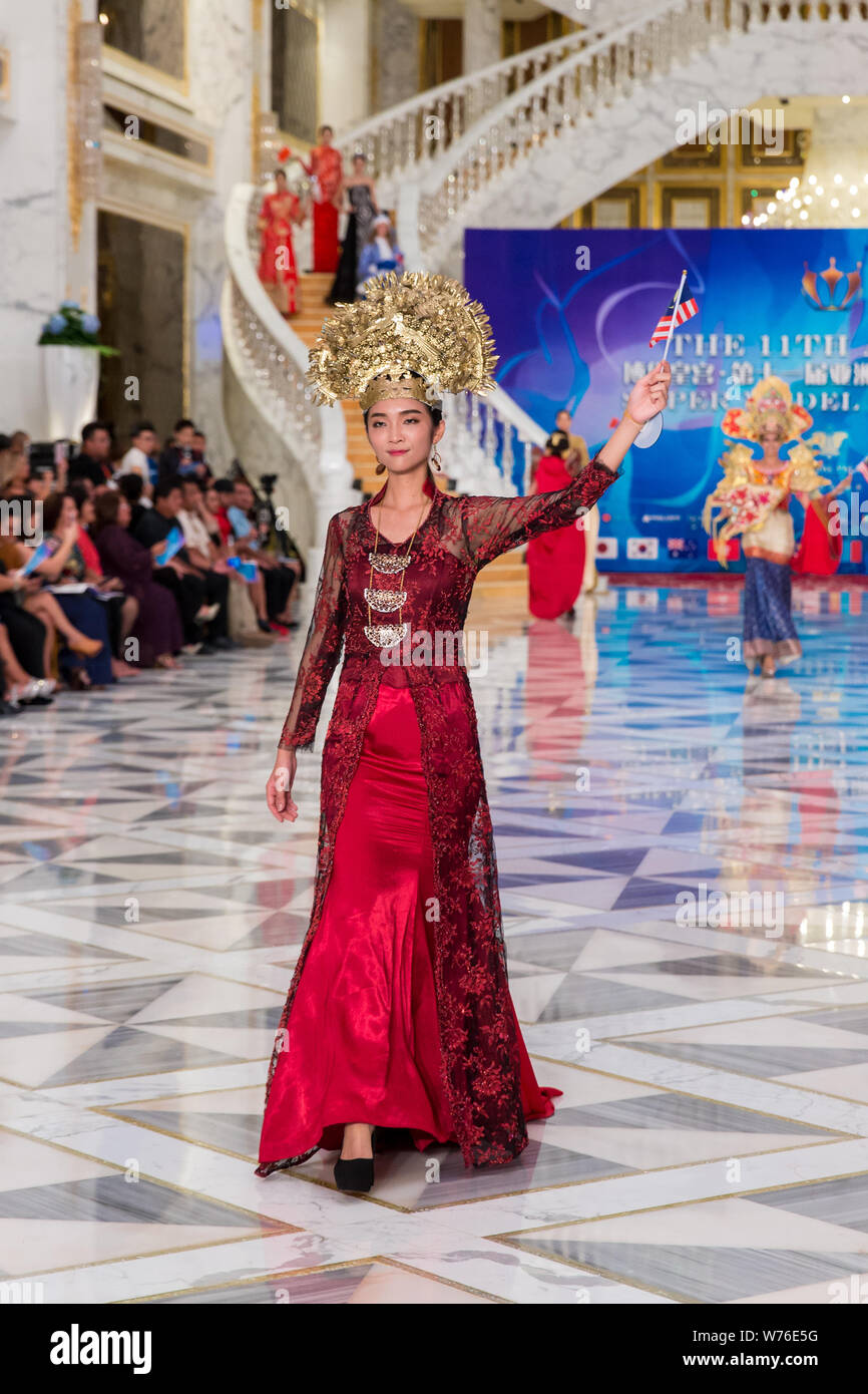 A contestant displays a creation during the 11th Asian Supermodel Contest at Imperial Palace in Saipan, Northern Mariana Islands, 16 December 2017. Stock Photo