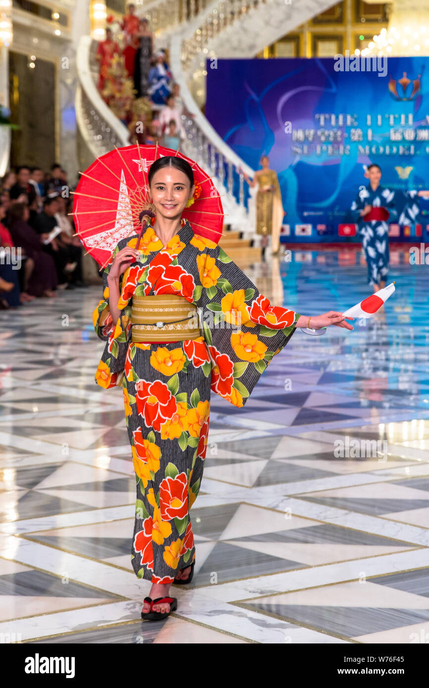 A contestant displays a creation during the 11th Asian Supermodel Contest at Imperial Palace in Saipan, Northern Mariana Islands, 16 December 2017. Stock Photo