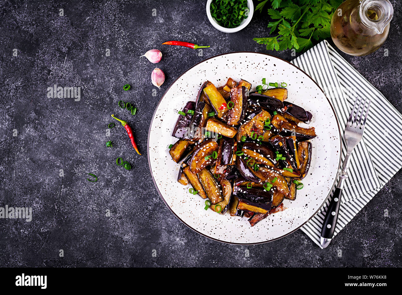 Hot spicy stew eggplant in Korean style with green onion. Aubergine