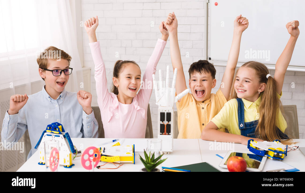 Children raising hands hi-res stock photography and images - Alamy